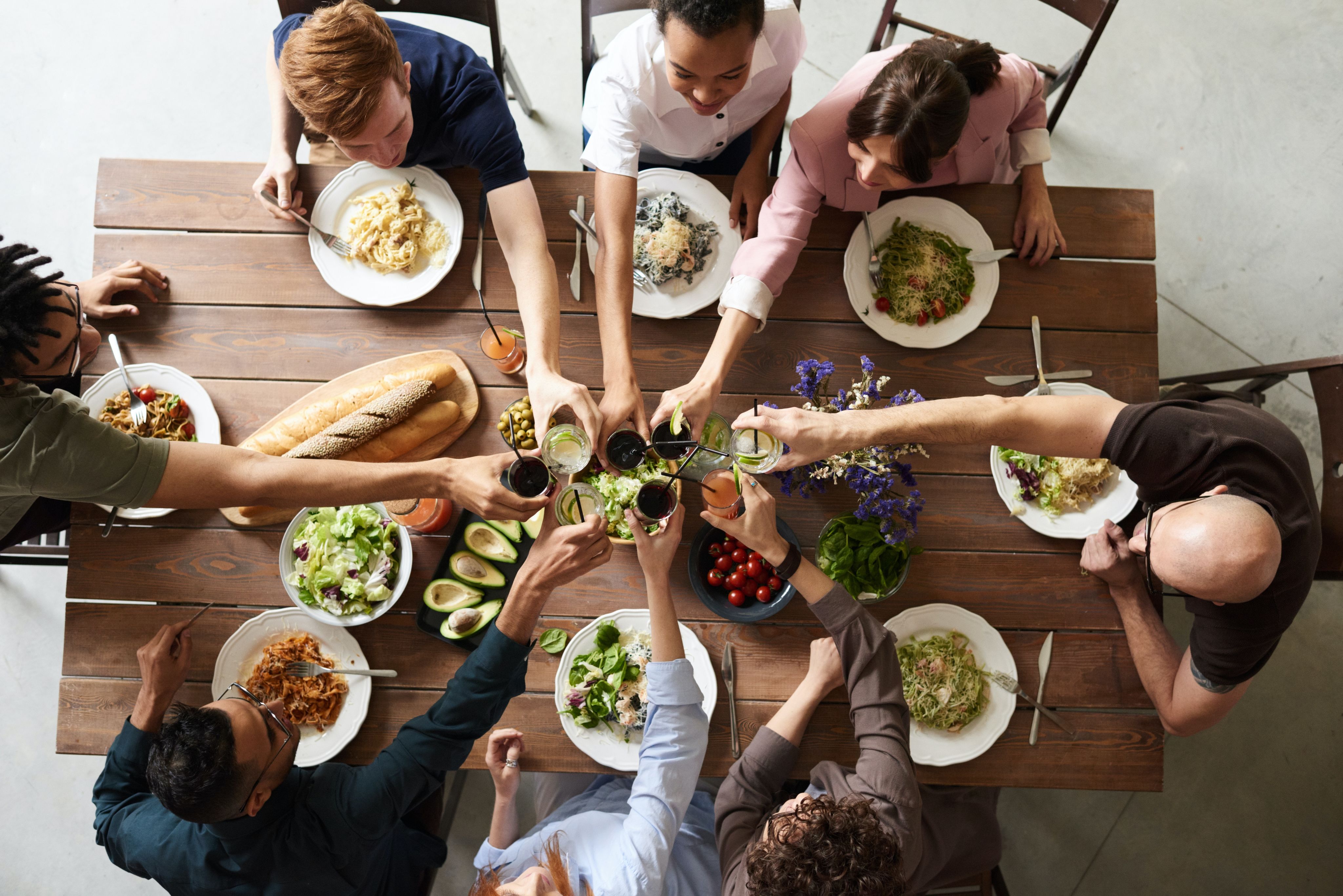 An overhead shot of a group of people sharing food
