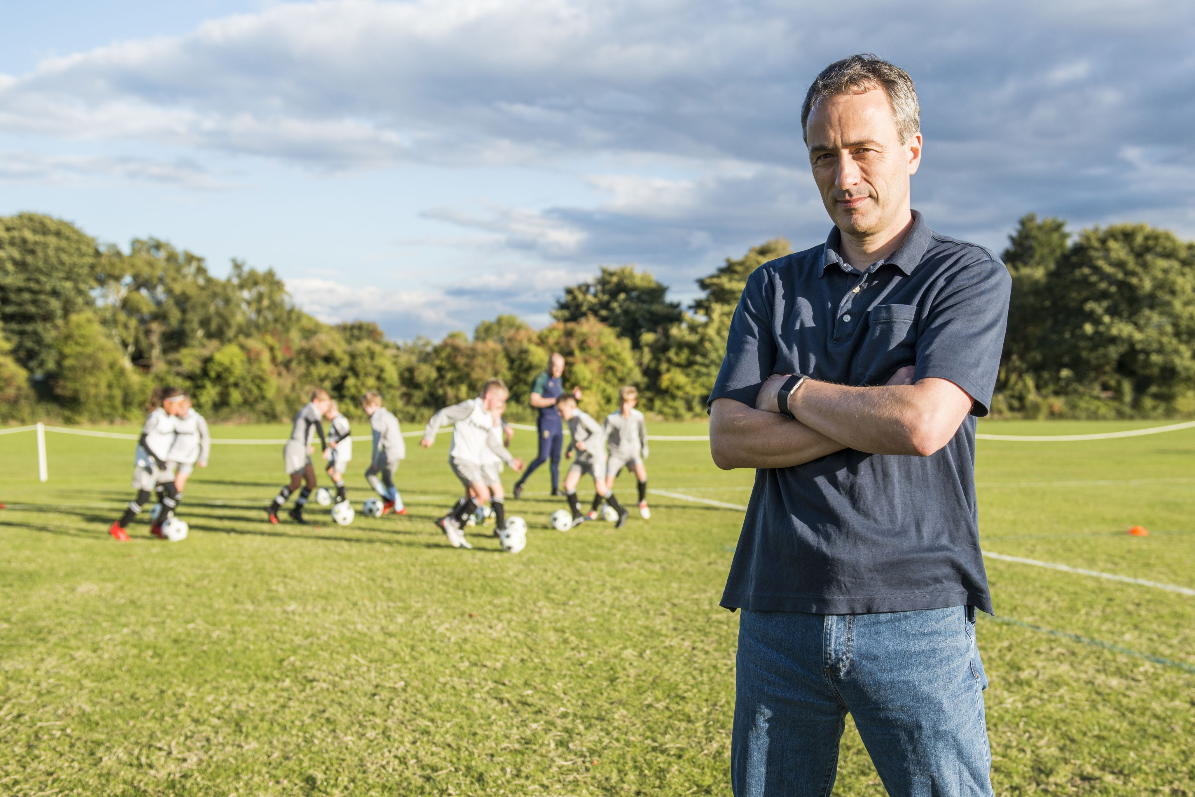 Professor Sean Cumming with young players.