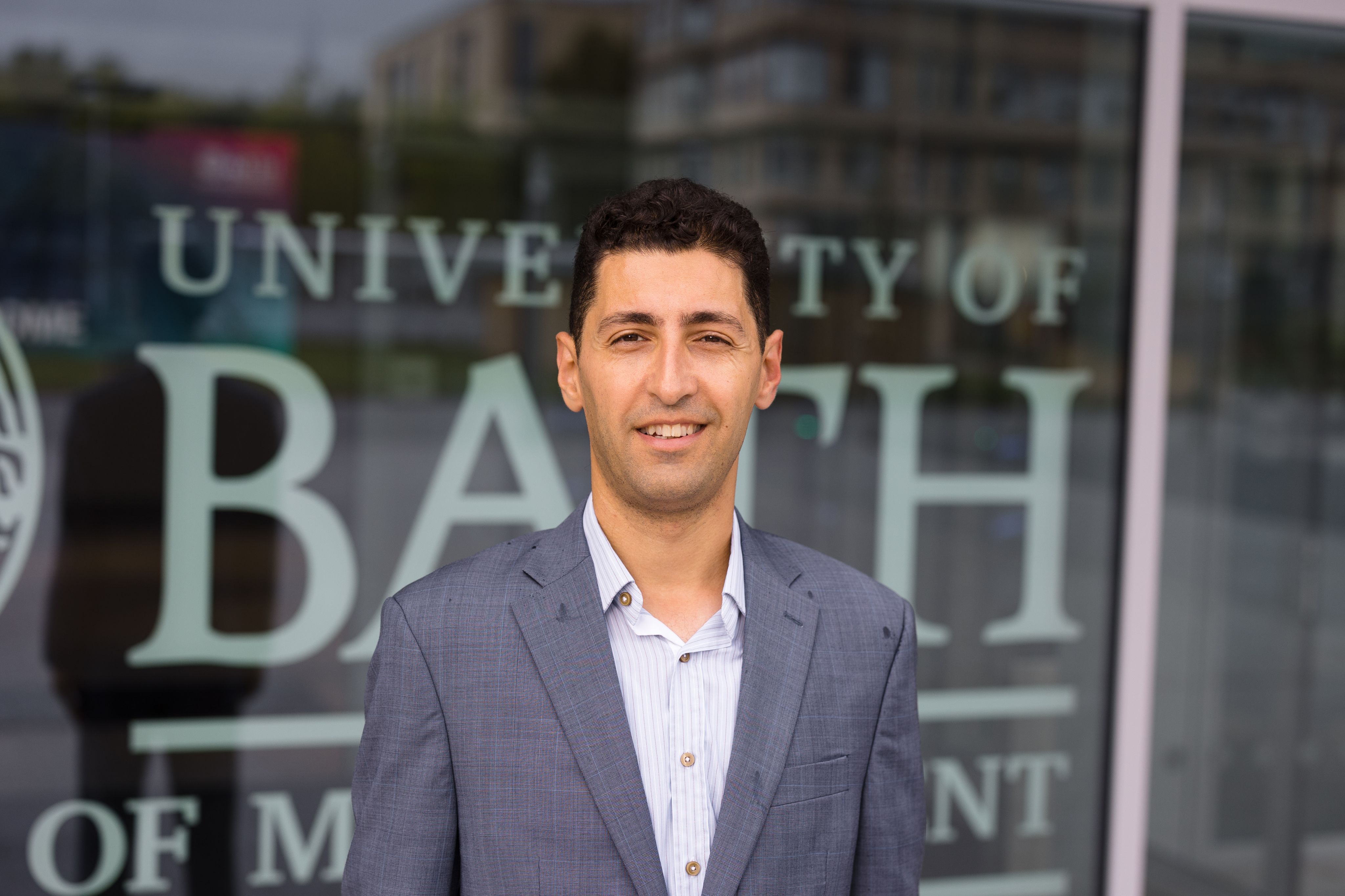 A portrait photo of Dr Melih Celik