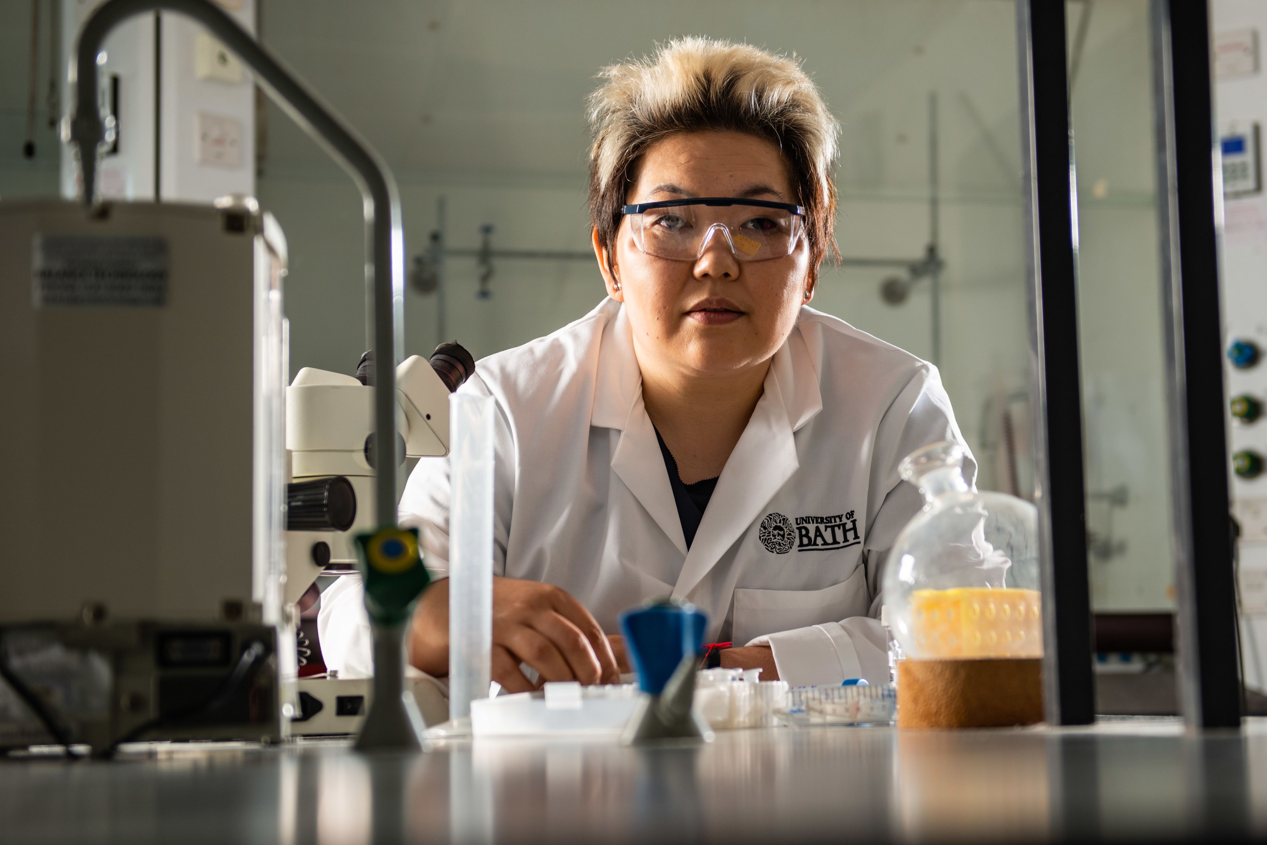 Female scientist in lab coat working in the lab